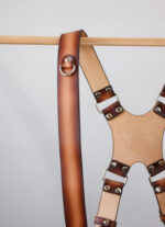 Handmade high-contrast leather strap featuring embossed logo, designed for photographers and accessory enthusiasts