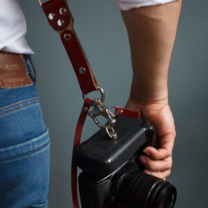 Handmade leather double camera strap with adjustable buckles, designed for professional photographers and accessories enthusiasts on the Personalized Dual Camera Straps page.