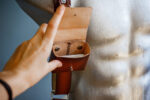 Handcrafted leather case for camera battery, flash card, and accumulator on a photography accessories website