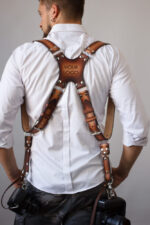 Handmade leather strap featuring high contrast design with custom logo, ideal for photographers and accessories enthusiasts