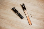 Leather slider component designed for Peak Design Anchor carabiner attachments on handmade leather accessories for photographers and outdoor enthusiasts.