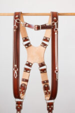 Handmade leather camera strap set with detailed stitching, ideal for photographers and accessory enthusiasts